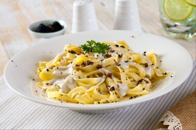 Linguine with cream and truffle shavings