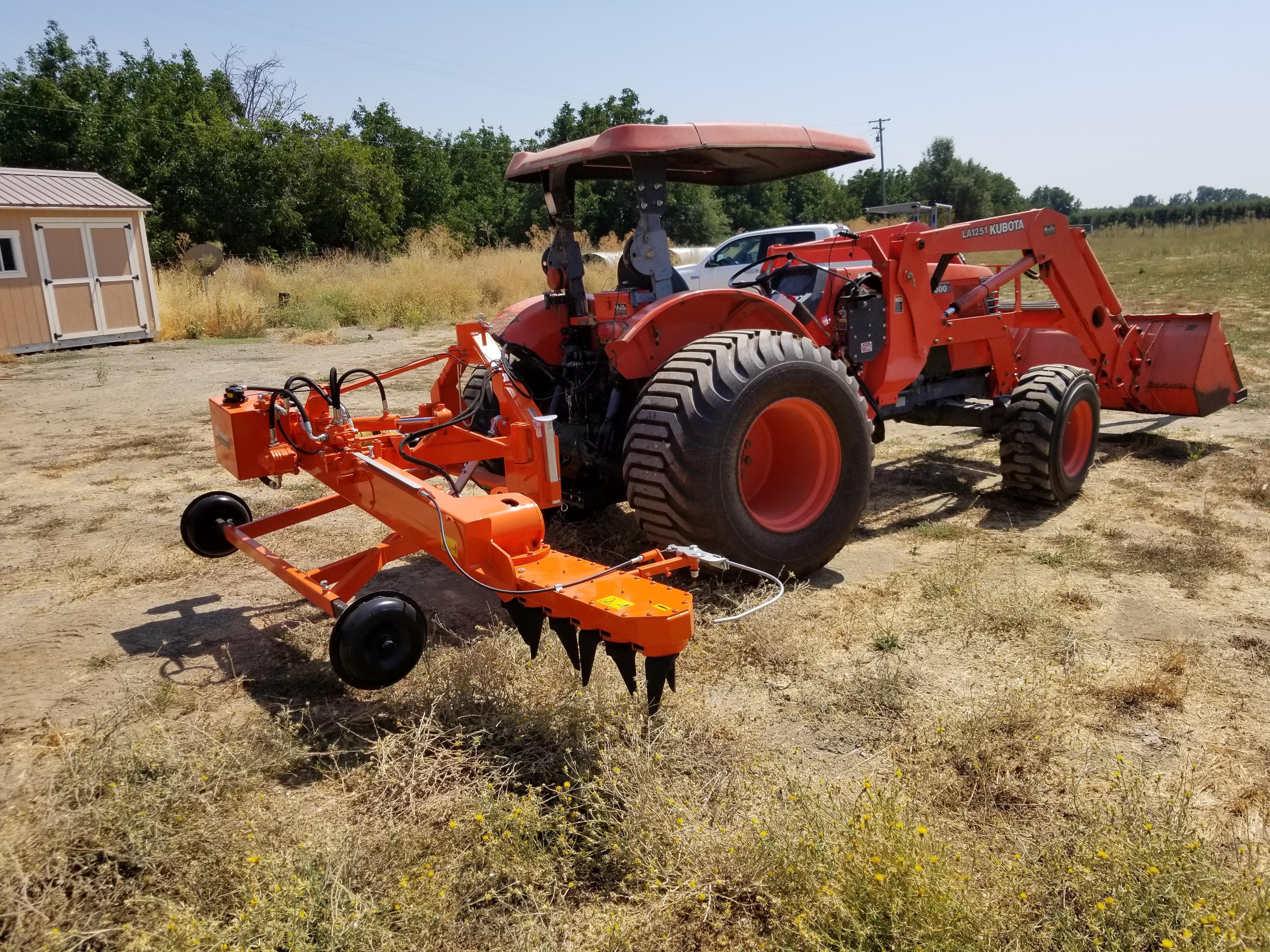 Kubota M9000 with loader and Rinieri Power Harrow